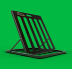 Black AHHA Toaster folding bike stand opened on a green background