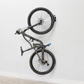 Single bike hanging on a swivel wall hook