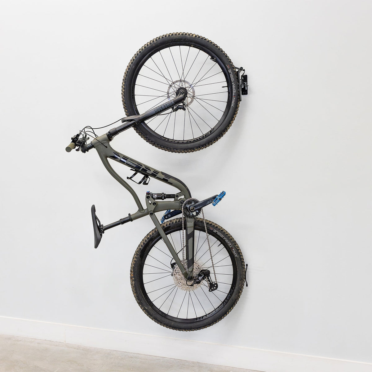 Single bike hanging on a swivel wall hook