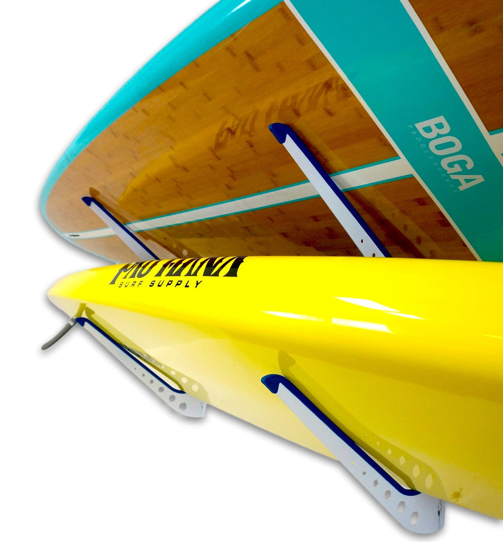 Close-up of paddleboards resting on the SUP rack arms