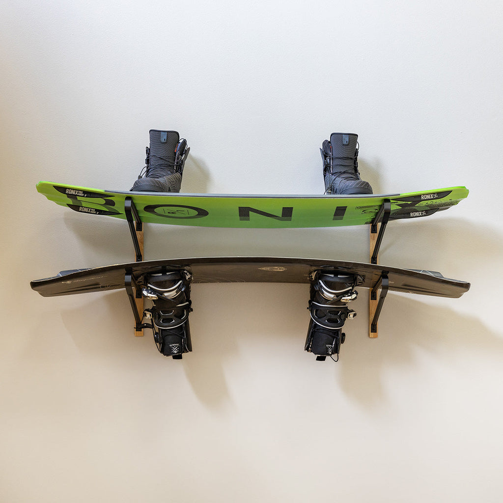 Wakeboard with bindings stored on the surfboard wall rack