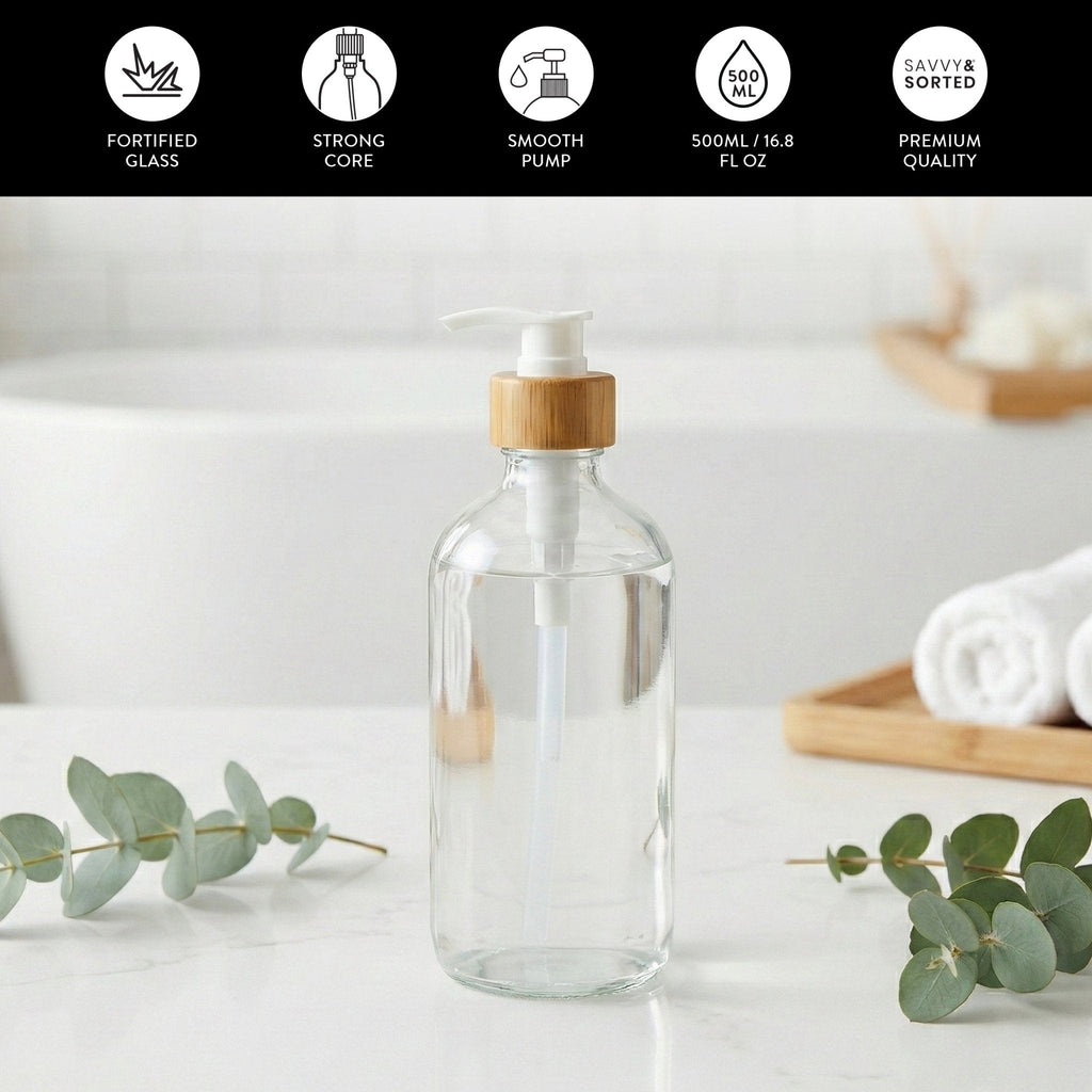 Clear glass pump bottle on a bathroom counter; fortified glass, 500 ml