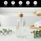 Clear glass pump bottle on a bathroom counter; fortified glass, 500 ml