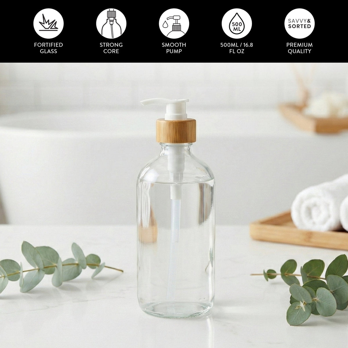Clear glass pump bottle on a bathroom counter; fortified glass, 500 ml