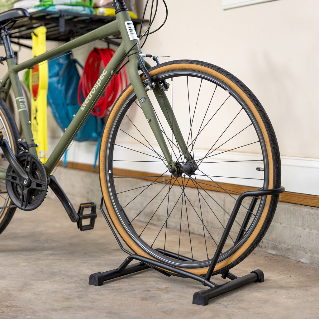 Bike wheel resting in the floor stand, angled view