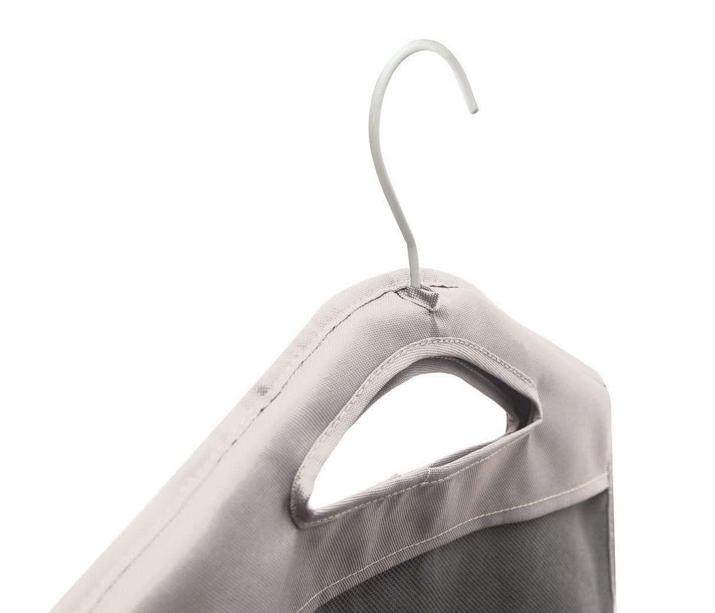 Close-up of the beige hamper's hanger hook and built-in carry handle