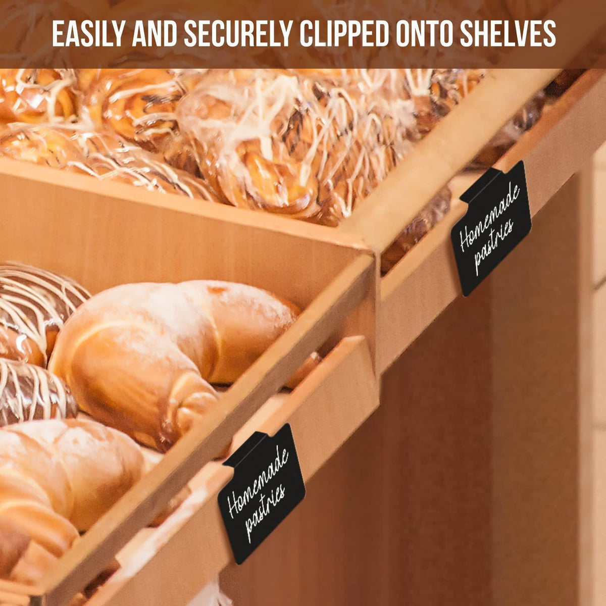 Reusable black clip-on chalkboard labels attached to wooden bakery display shelves