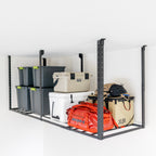 Overhead ceiling rack loaded with bins, a cooler and camping gear