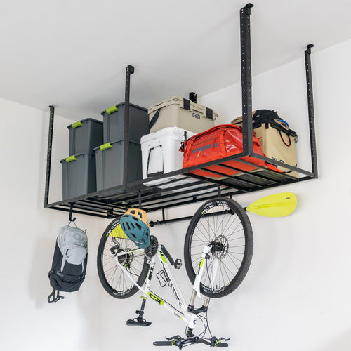 Overhead ceiling rack with bins and a cooler, with a bike and backpack hanging from hooks below