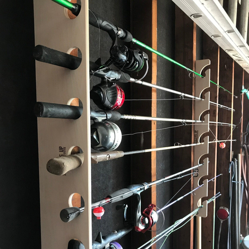 Wood fishing rod rack holding several rods with reels