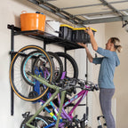 Woman placing a bin on the top shelf above hanging bikes