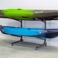 Two kayaks on the mud-colored 2-level rolling kayak rack