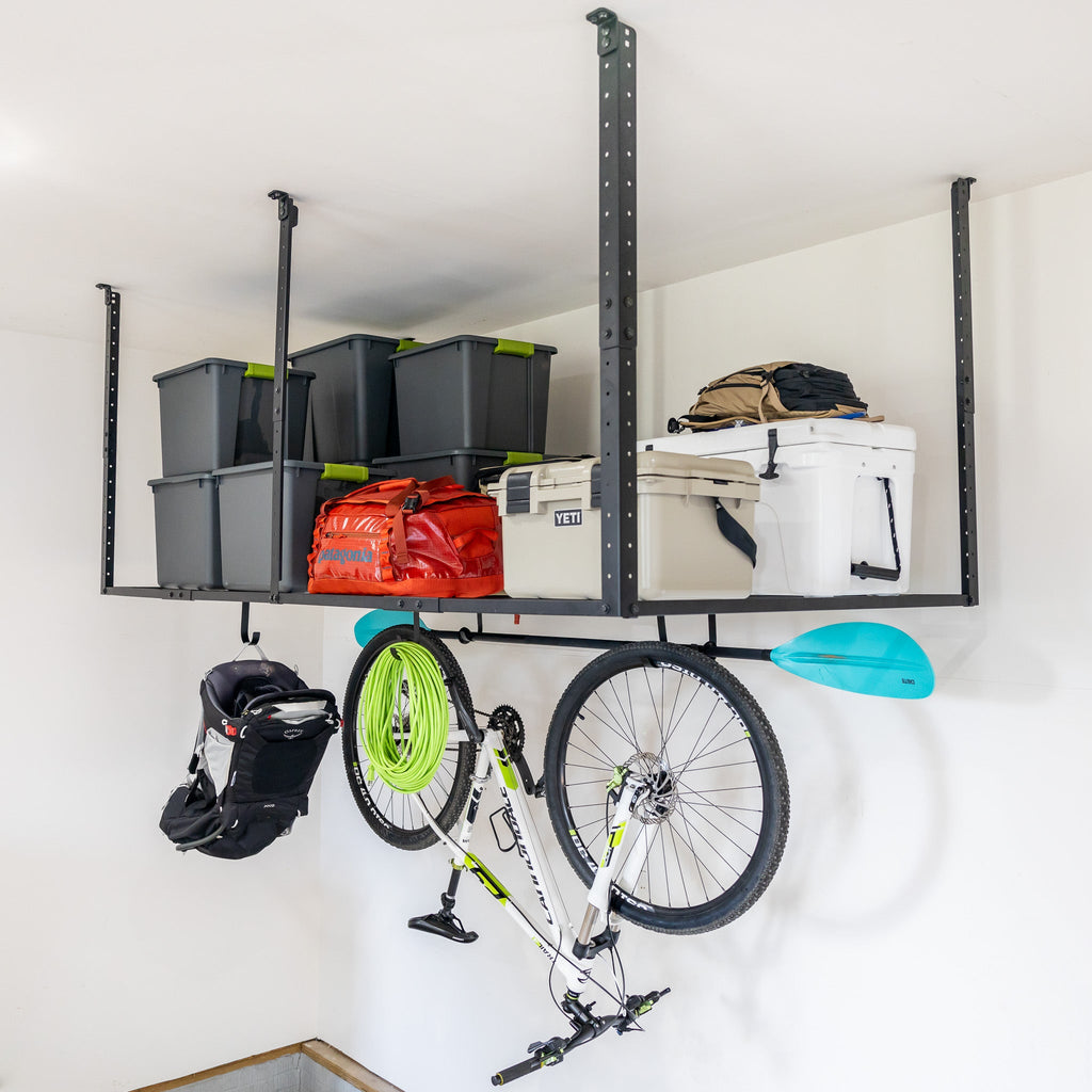 4 x 8 ft overhead ceiling rack with bins and a cooler, with a bike and helmet hanging from hooks below