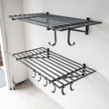 Two empty black 2 x 4 ft wall shelves with hooks underneath