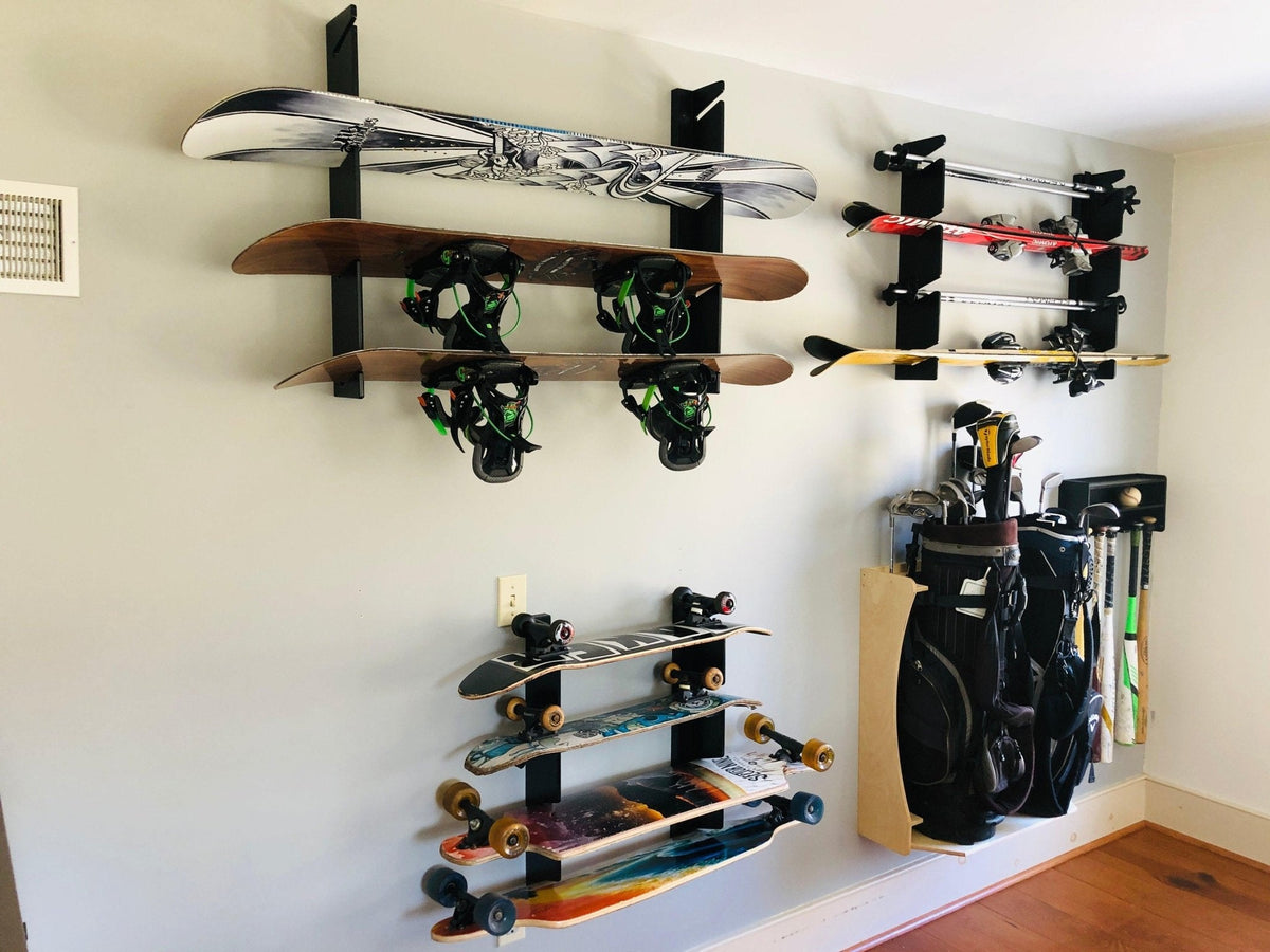 Skateboard wall organizers holding skateboards on a bedroom wall