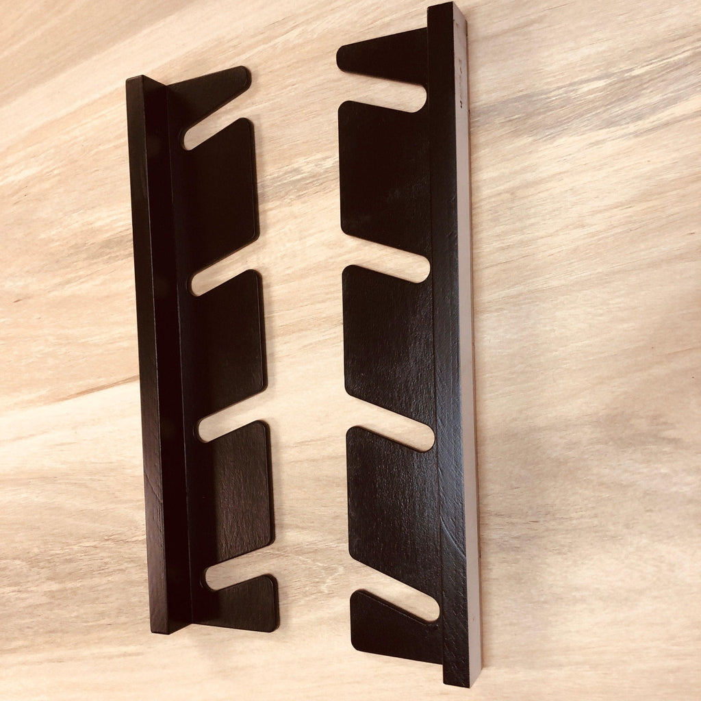 Empty black skateboard wall organizer
