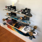 Skateboard organizer holding four longboards and skateboards