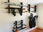 Wall of snowboard, fishing rod and skateboard racks