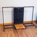 Empty black Headliner guitar rack with storage pouch and pedal board