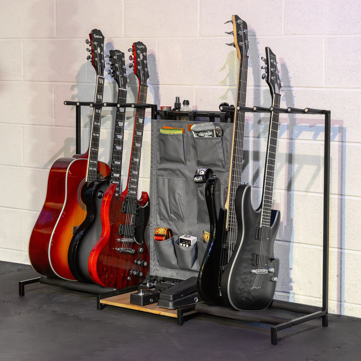 Gray Headliner guitar rack holding several guitars and a pedal board