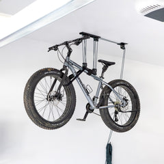 Fat tire bike lifted to the ceiling by the MaxAssist bike hoist