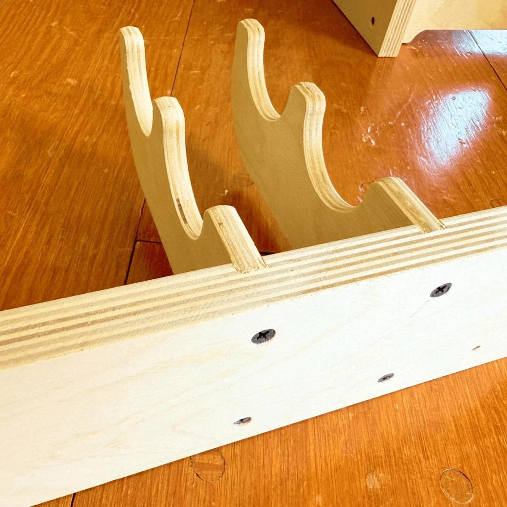 Close-up of the wood hook rack slots and mounting holes