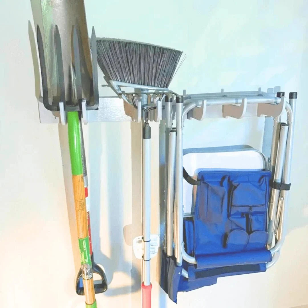 Hook rack holding a shovel, broom and folding chair