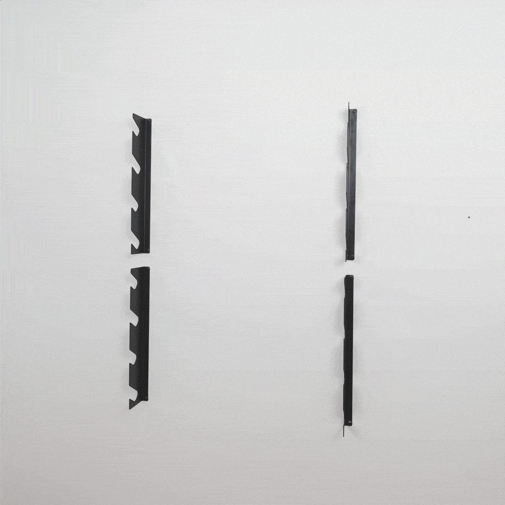 Two empty 8-level tool organizer brackets mounted on a wall