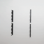 Two empty 8-level tool organizer brackets mounted on a wall