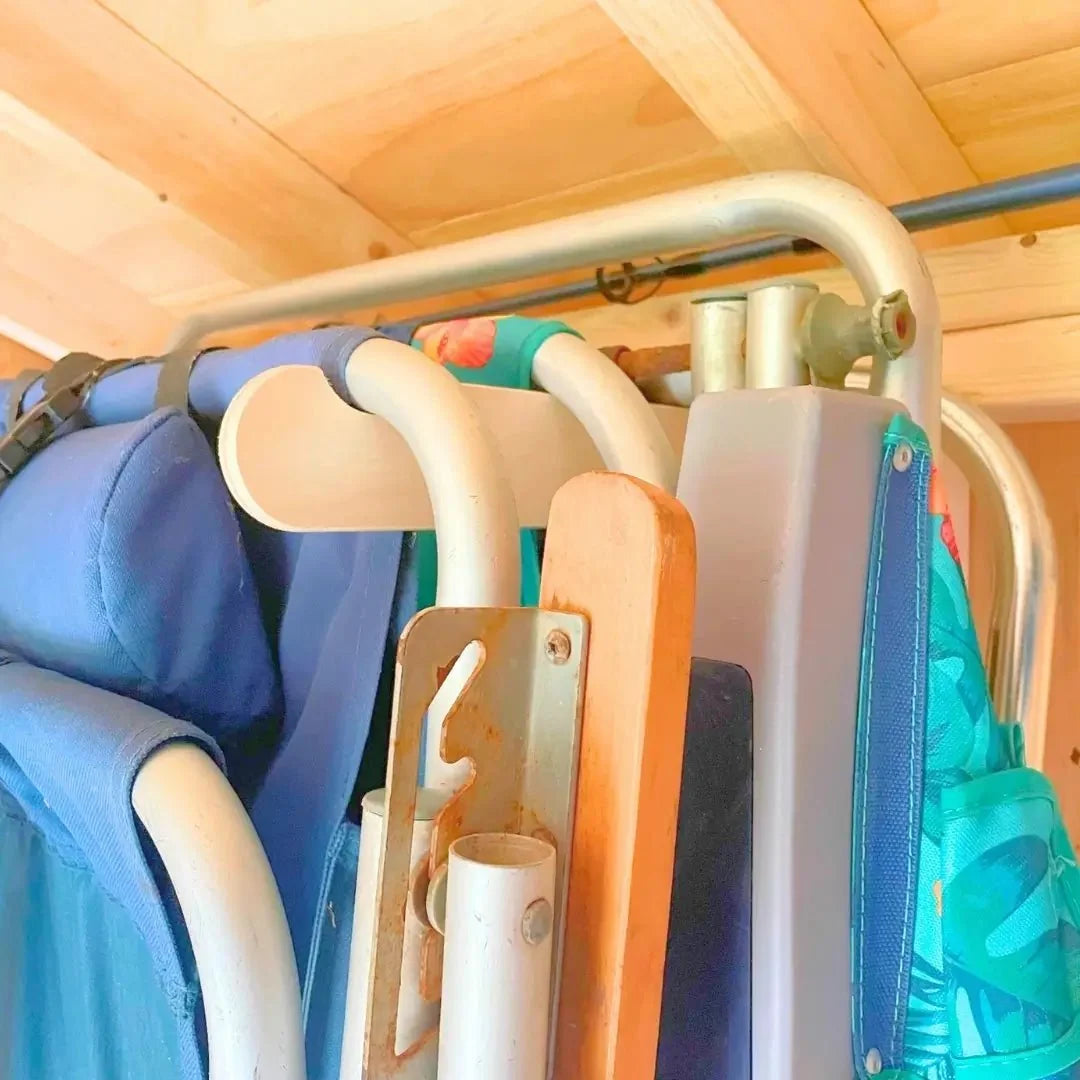 Folding chairs stored on lawn chair hooks, side view