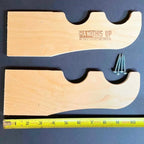 Wood hooks with mounting screws and a ruler showing their size