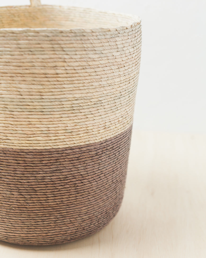 Close-up of the natural and Pewter palm weave on a Prado basket