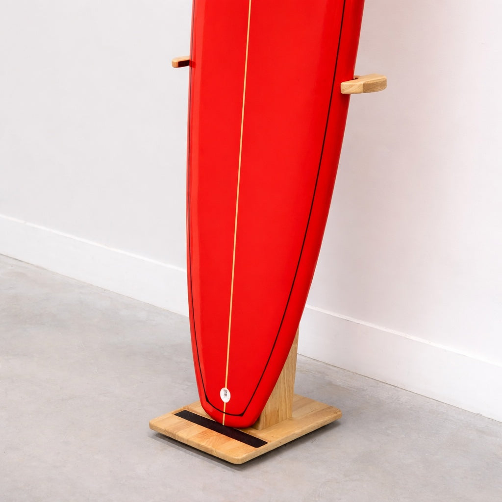 Red surfboard standing in the wood SurfStand