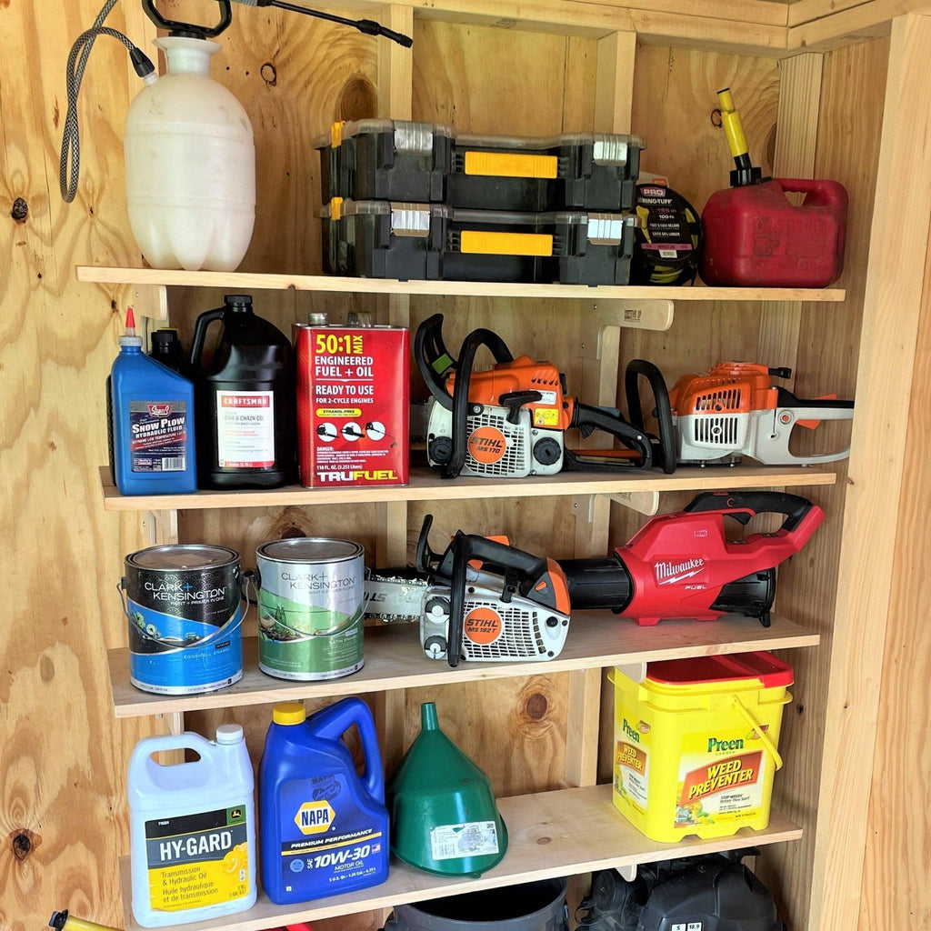 Shed shelf brackets holding paint cans, tool cases and supplies on a wooden shed wall