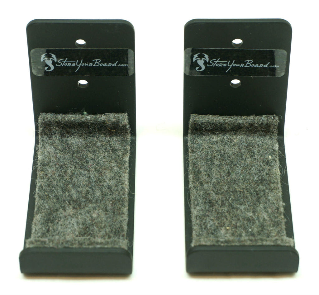 Front view of two medium minimalist wall hooks with felt padding