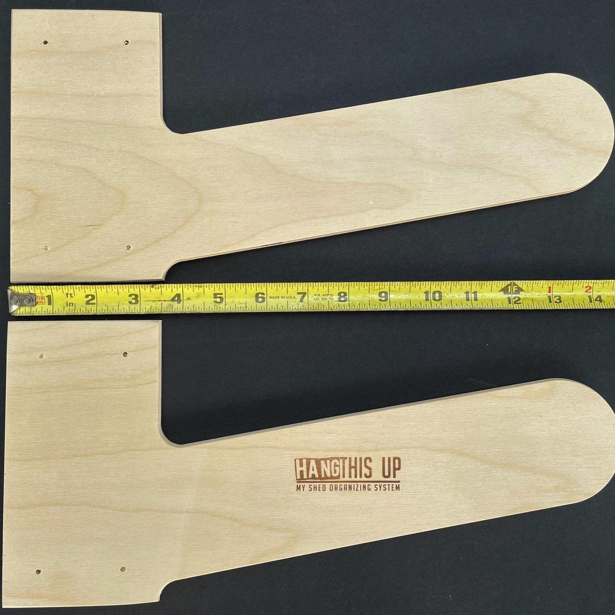 Two wood step ladder rack pieces with a ruler showing their length