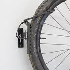 Close-up of a tire held by the swivel hook
