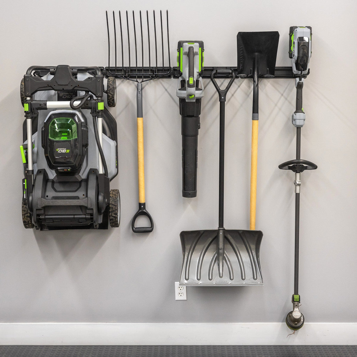 Lawn mower, rake, leaf blower, snow shovel and trimmer hung on the 64-inch organizer