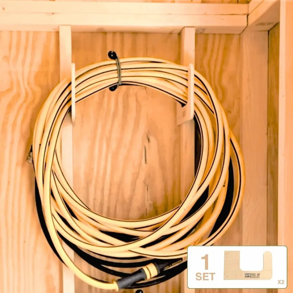 Extension cord coiled on a wood hose hook