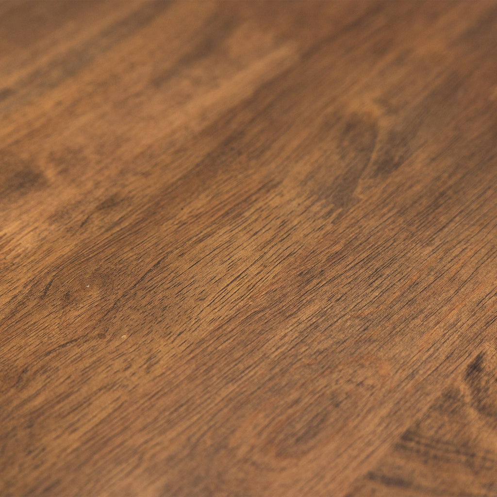 Close-up of the dark wood workbench top grain