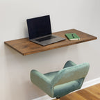 Folding workbench used as a desk with a laptop and chair