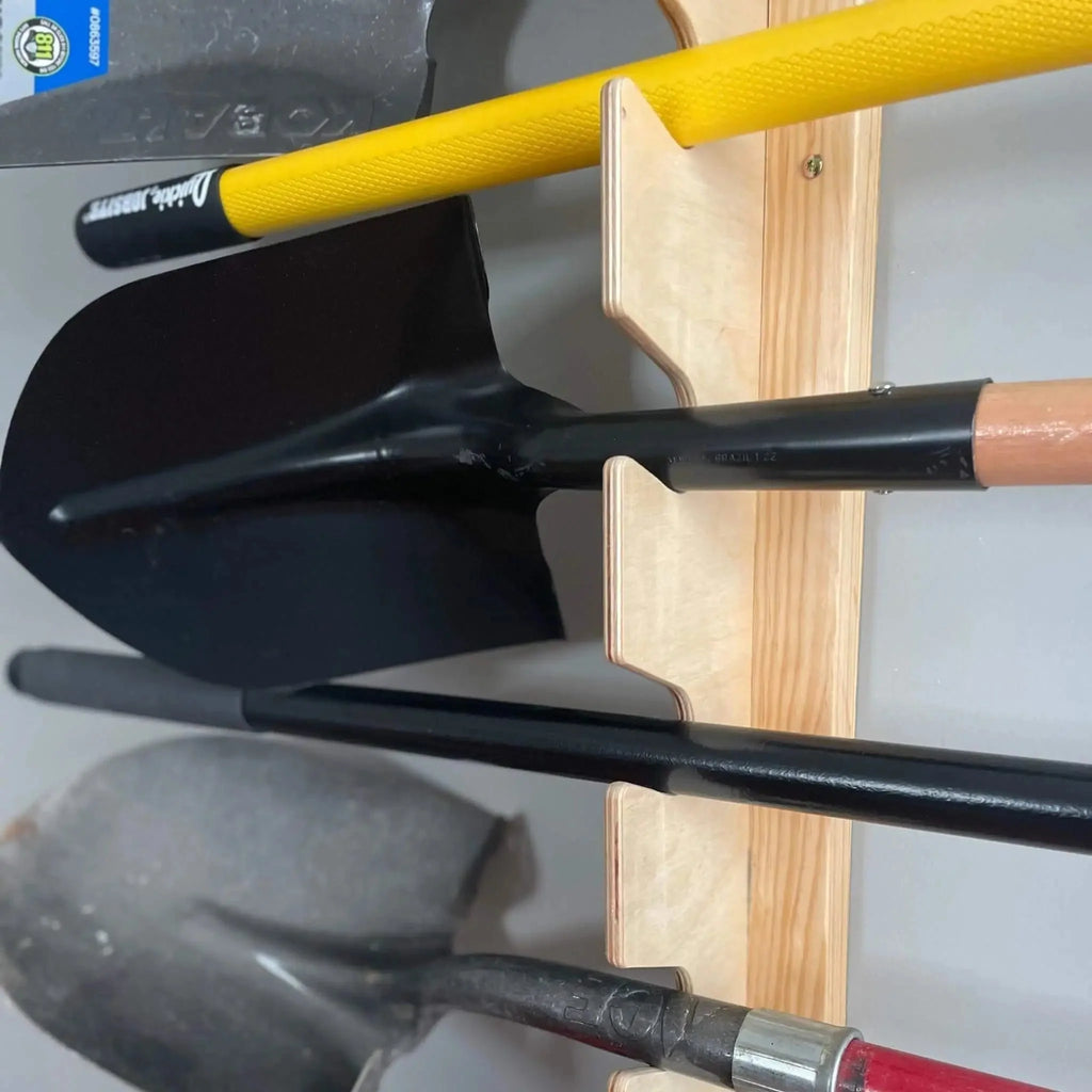 Shovels hanging from the garden tool rack