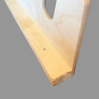 Close-up of a garden tool rack slot