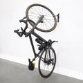 Bike hanging vertically on a single WheelRest wall hook