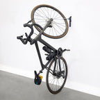 Bike hanging vertically on a single WheelRest wall hook