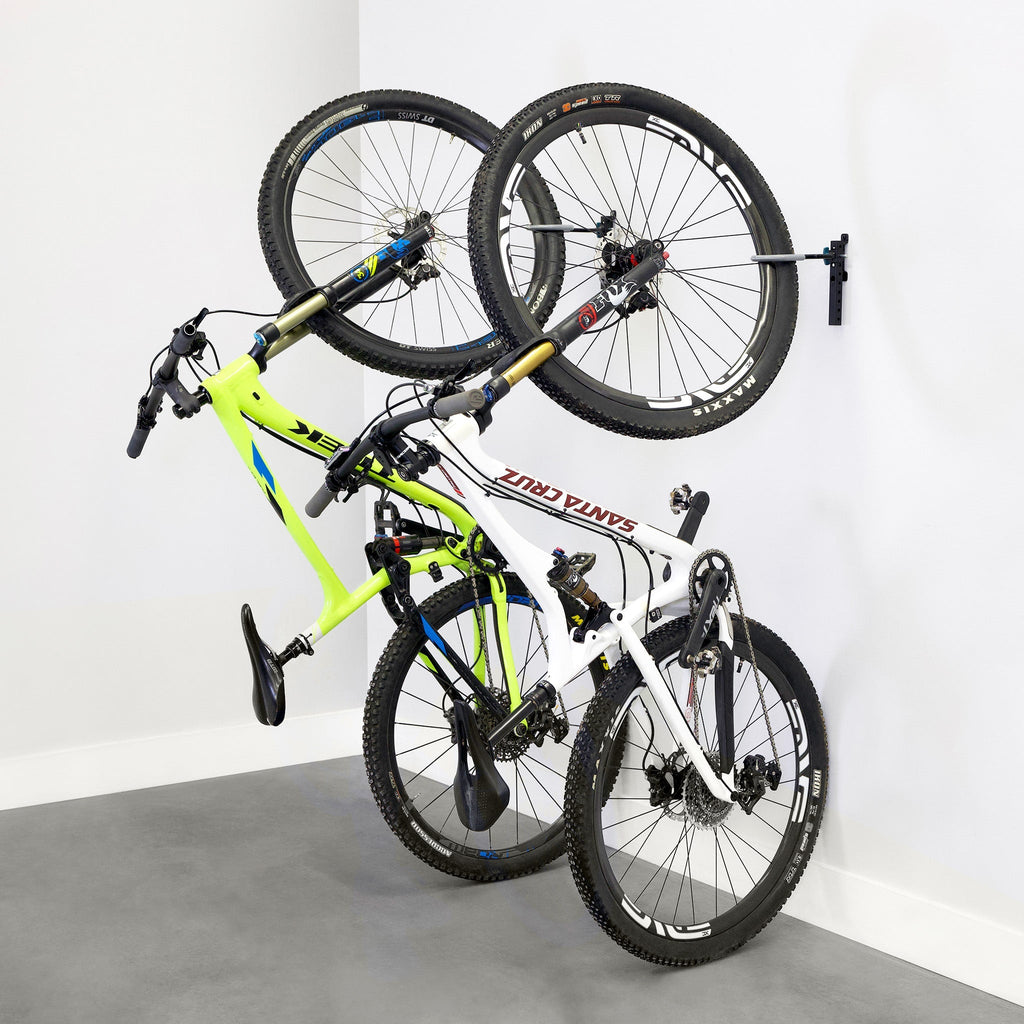 Two bikes hanging on WheelRest wall hooks