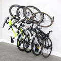 Four bikes hanging on WheelRest wall hooks, angled view