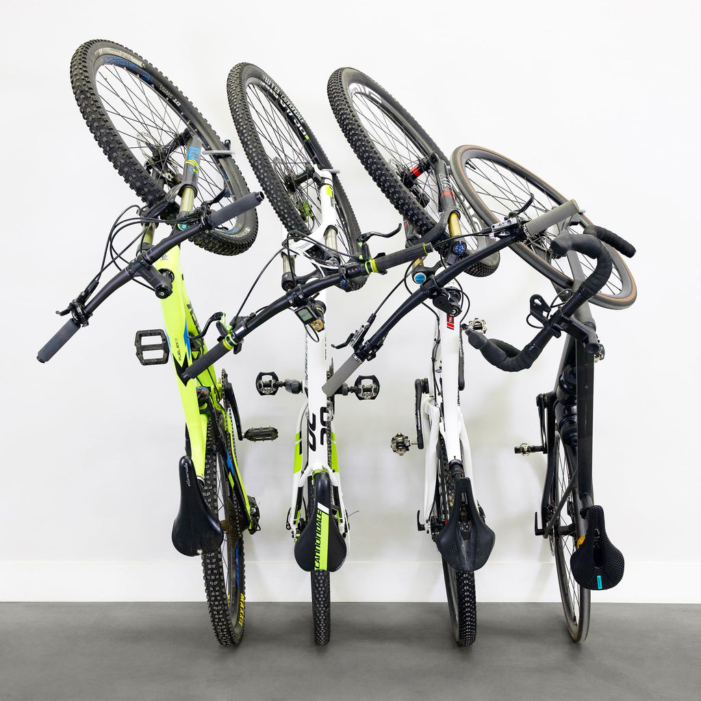 Four bikes hanging on WheelRest hooks, front view